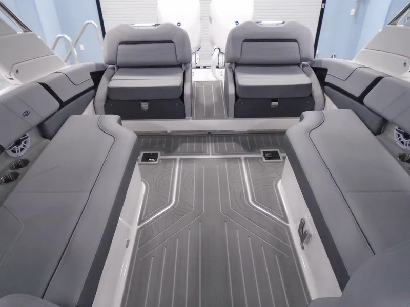 Slide: The Image of 2024 Regal LX9 boat interior with gray seating and flooring. - 25