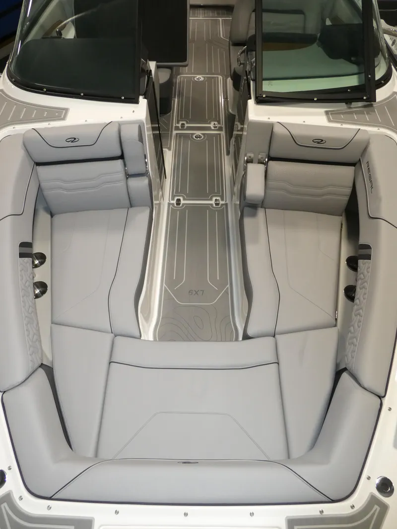 Slide: The Image of 2024 Regal LX9 boat interior with gray seating and modern design. - 26