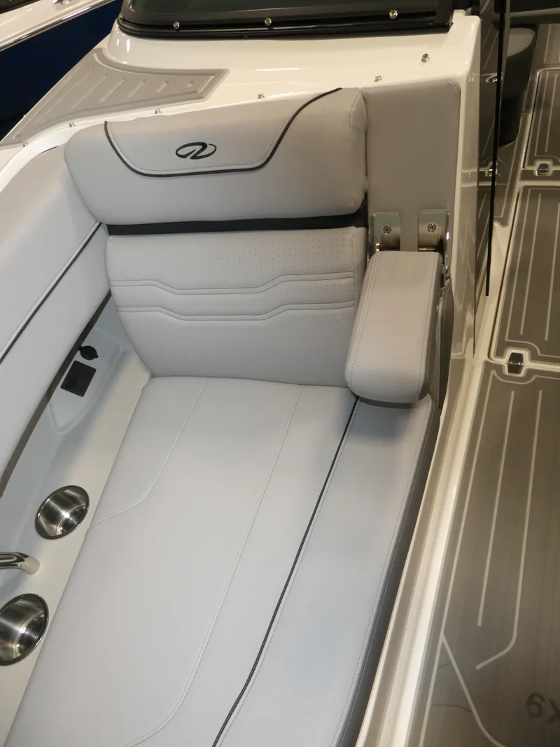 Slide: The Image of 2024 Regal LX9 boat interior with luxurious seating and cup holders. - 28