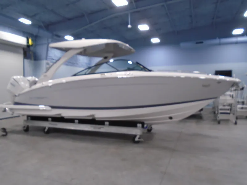 Slide: The Image of 2024 Regal LX9 boat in a showroom, featuring sleek design and modern amenities. - 3