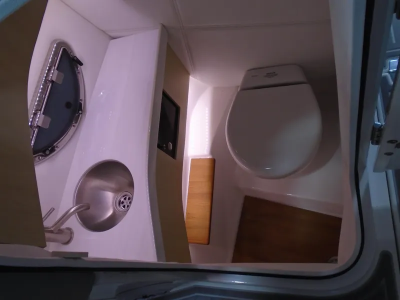 Slide: The Image of 2024 Regal LX9 boat bathroom with modern sink and toilet. - 34