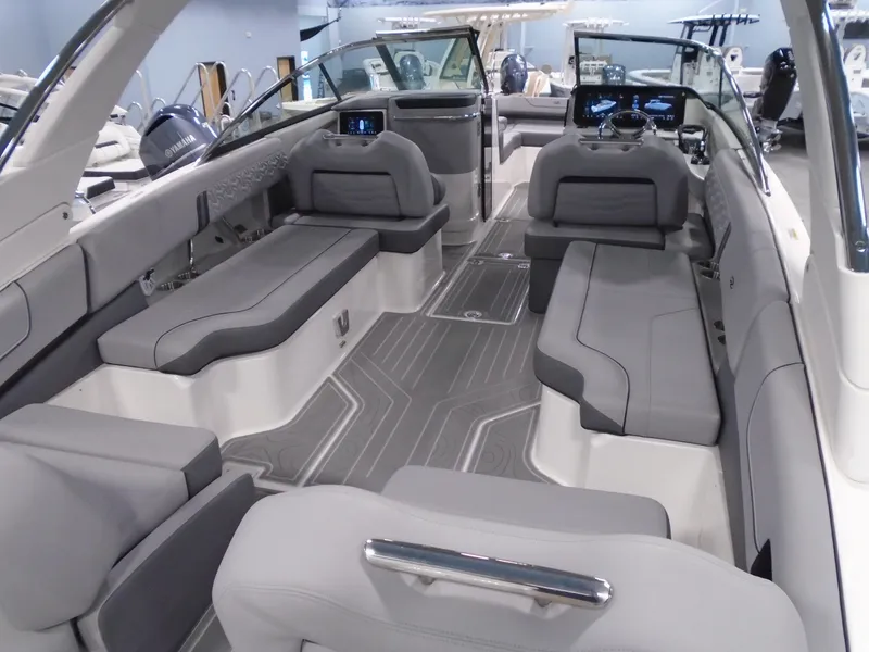 Slide: The Image of 2024 Regal LX9 boat interior with sleek gray seating and modern dashboard. - 39