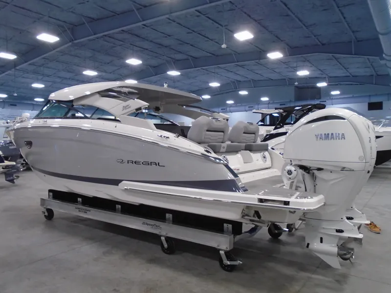 Slide: The Image of 2024 Regal LX9 boat with Yamaha engine in showroom. - 4