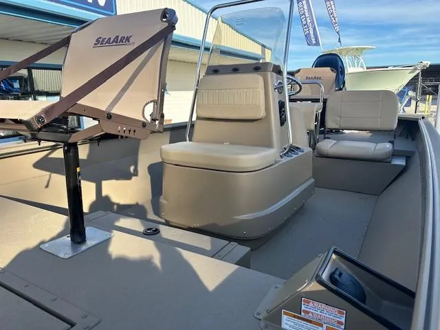 Slide: The Image of 2024 SeaArk 2072 VFX Elite CC boat interior with seating and console. - 5