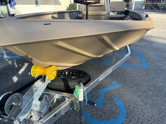 Slide: The Image of 2024 SeaArk 2072 VFX Elite CC boat on a trailer in a parking lot. - 7