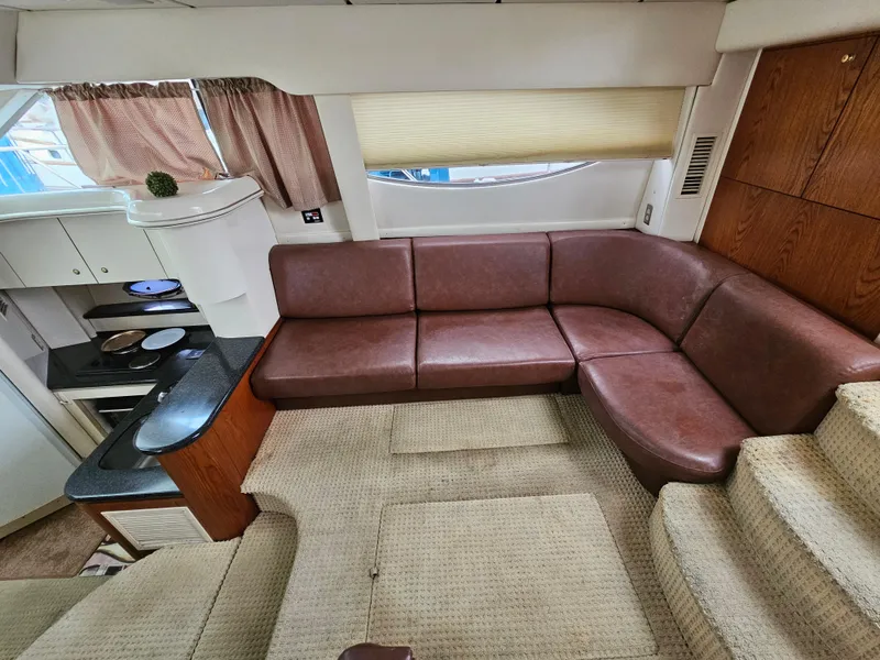 Slide: The Image of Interior of 2000 Maxum 4100 SCA yacht with leather seating and kitchenette. - 10