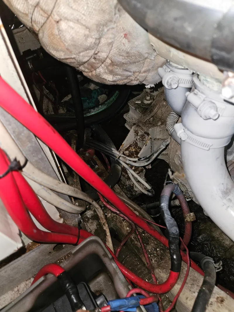 Slide: The Image of Engine compartment of a 2000 Maxum 4100 SCA boat with visible wiring and hoses. - 45