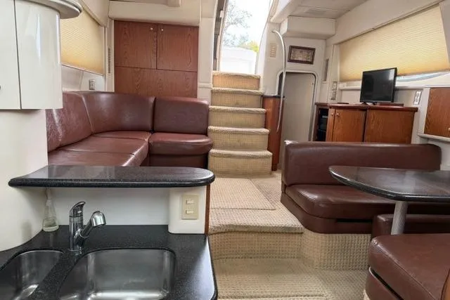 Slide: The Image of Luxurious interior of 2000 Maxum 4100 SCA yacht with leather seating and modern amenities. - 66