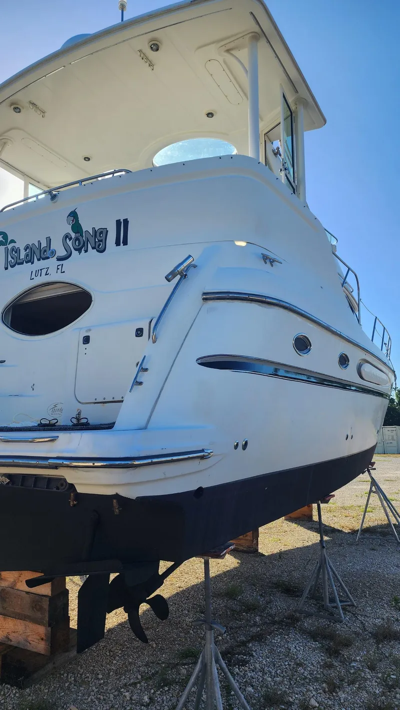 Slide: The Image of 2000 Maxum 4100 SCA yacht on stands, rear view, named Island Song II. - 7