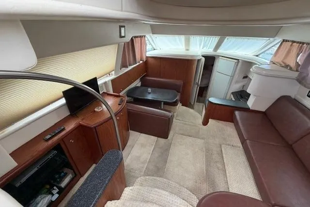 Slide: The Image of Interior of 2000 Maxum 4100 SCA yacht with elegant seating and modern amenities. - 82
