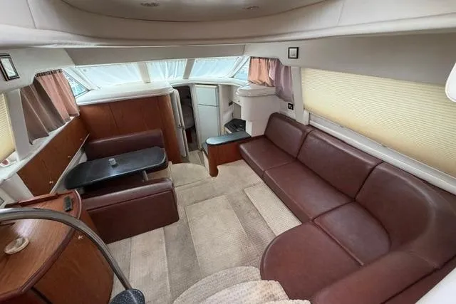 Slide: The Image of Luxurious interior of 2000 Maxum 4100 SCA yacht with leather seating and modern design. - 84