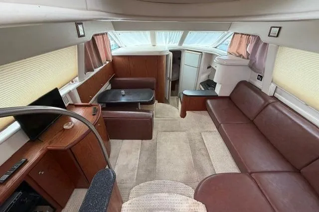 Slide: The Image of Luxurious interior of 2000 Maxum 4100 SCA yacht with leather seating and modern amenities. - 85