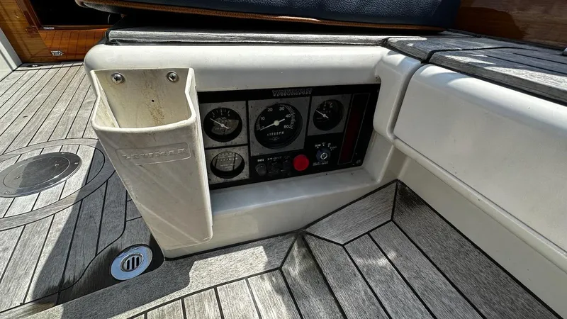 Slide: The Image of Control panel of a 2004 Lyman-Morse Sparkman & Stephens Sloop on a wooden deck. - 11