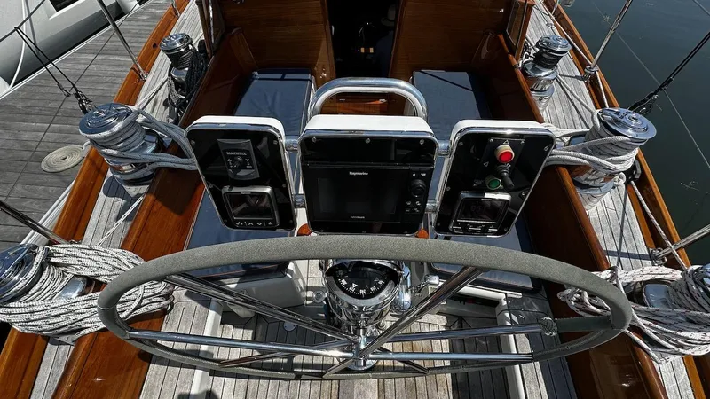 Slide: The Image of Cockpit of 2004 Lyman-Morse Sparkman & Stephens Sloop with steering wheel and navigation instruments. - 15