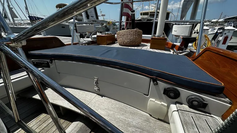 Slide: The Image of Cockpit of 2004 Lyman-Morse Sparkman & Stephens Sloop with cushioned seating and wooden accents. - 17