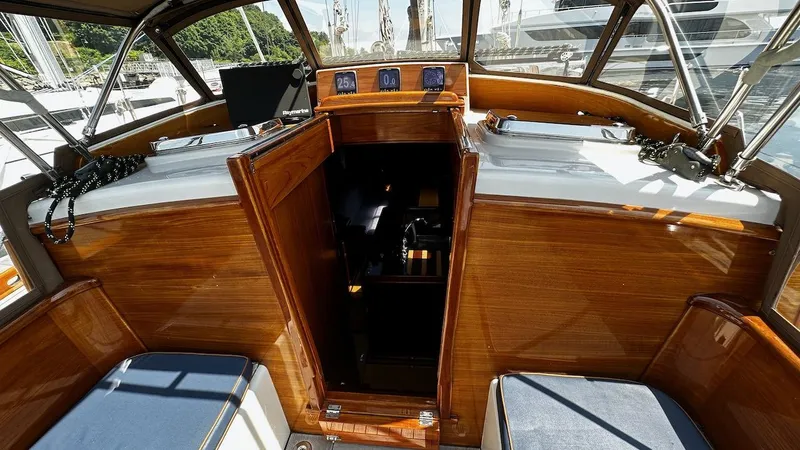Slide: The Image of Cockpit of 2004 Lyman-Morse Sparkman & Stephens Sloop with wooden finish and seating. - 20
