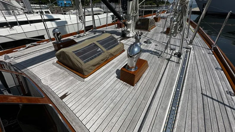 Slide: The Image of Deck of 2004 Lyman-Morse Sparkman & Stephens Sloop with wooden finish and nautical equipment. - 26