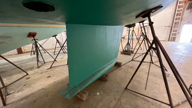 Slide: The Image of Lyman-Morse Sparkman & Stephens Sloop 2004 in dry dock, showing keel and hull. - 35