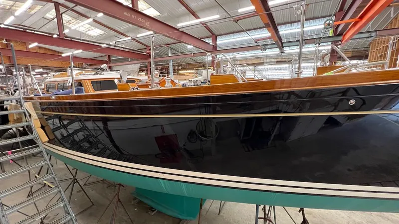 Slide: The Image of 2004 Lyman-Morse Sparkman & Stephens Sloop in a boatyard, side view. - 41