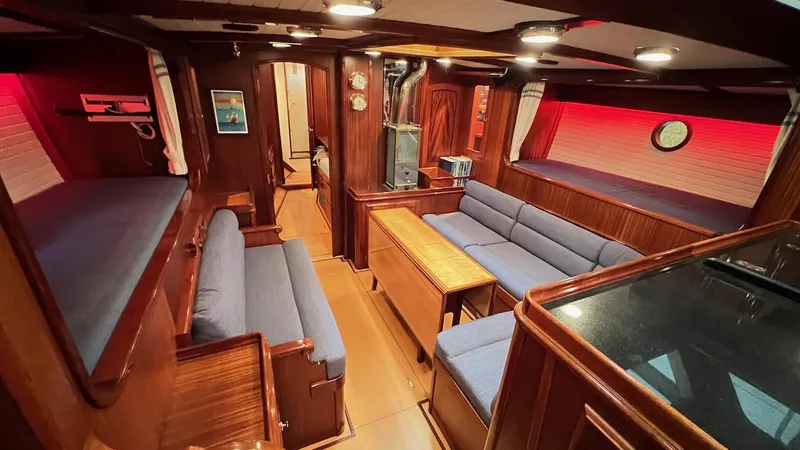 Slide: The Image of Interior of 2004 Lyman-Morse Sparkman & Stephens Sloop with cozy seating and wooden finishes. - 46