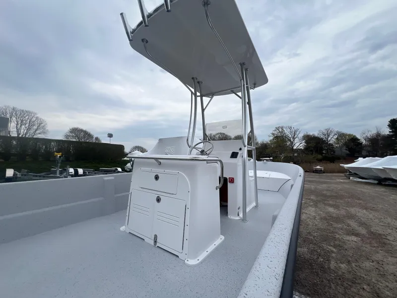 Slide: The Image of 2024 Maritime 2090 Skiff boat with center console and T-top on a cloudy day. - 17