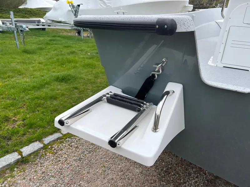 Slide: The Image of 2024 Maritime 2090 Skiff boat with foldable swim ladder on the stern. - 18