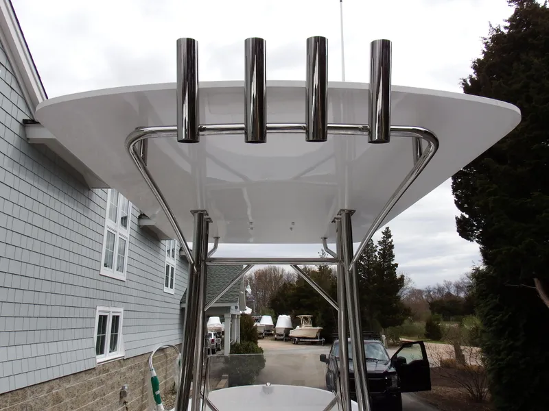 Slide: The Image of 2024 Maritime 2090 Skiff boat with T-top and rod holders. - 23