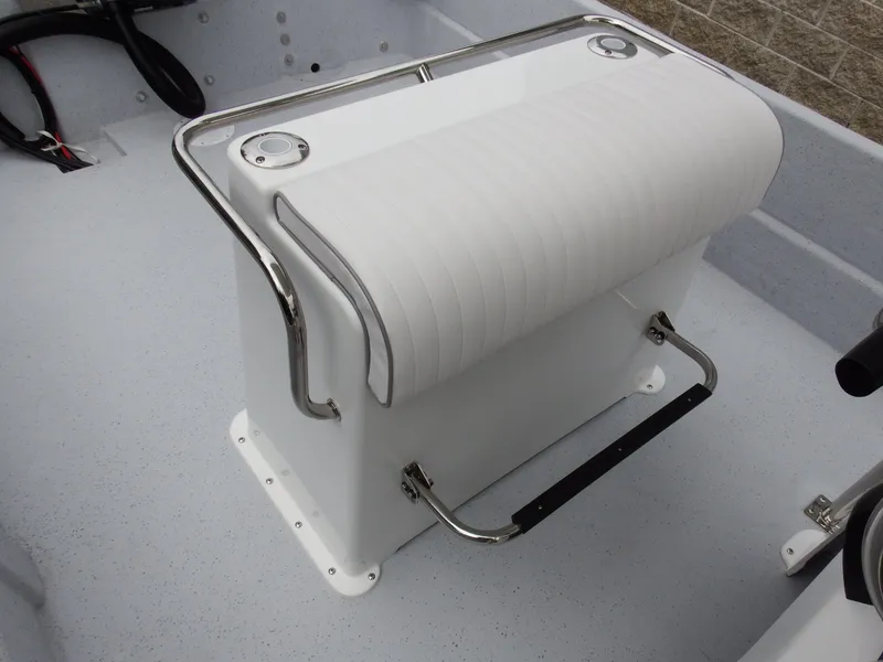 Slide: The Image of 2024 Maritime 2090 Skiff boat seat with white cushioned backrest and stainless steel handrails. - 26