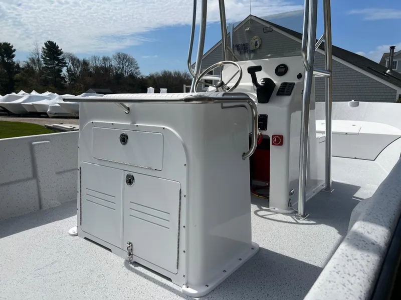 Slide: The Image of 2024 Maritime 2090 Skiff boat interior with console and storage compartments. - 8