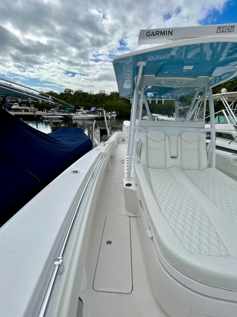 Slide: The Image of 2023 Invincible 36' Open Fisherman boat with Garmin electronics, docked at a marina. - 11