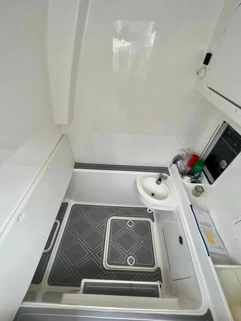 Slide: The Image of Interior of 2023 Invincible 36' Open Fisherman boat with sink and storage. - 13