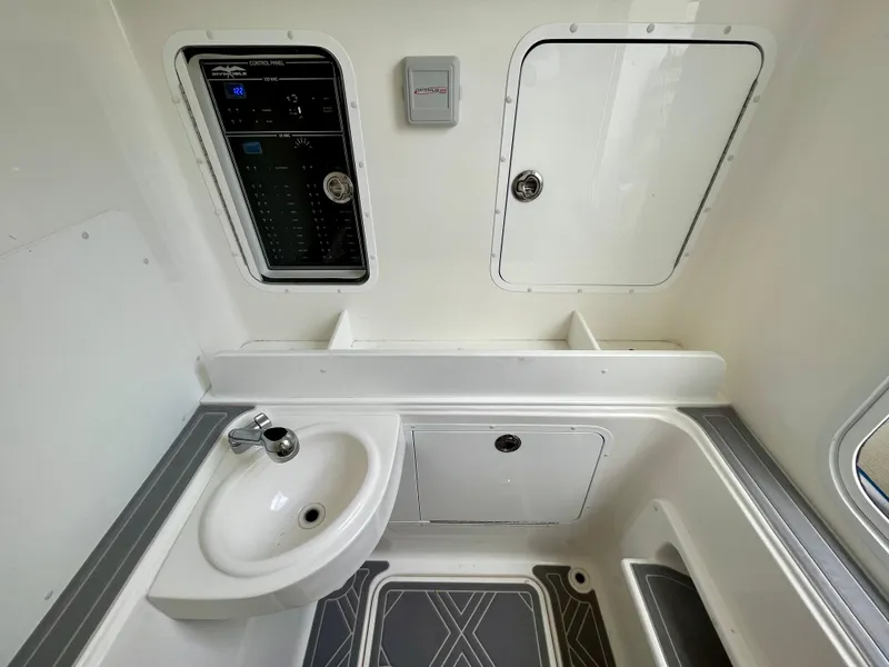 Slide: The Image of Interior of 2023 Invincible 36' Open Fisherman boat with sink and control panel. - 14