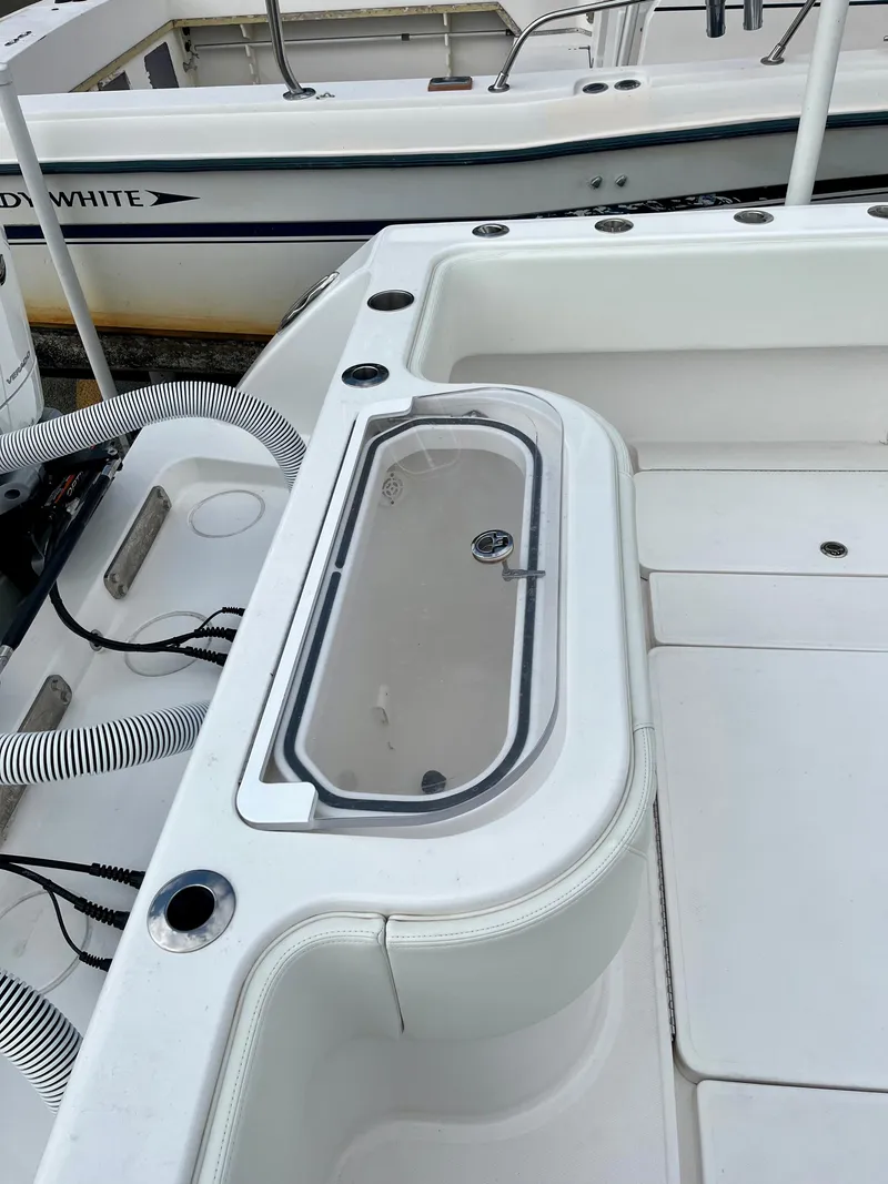 Slide: The Image of 2023 Invincible 36' Open Fisherman boat deck with storage compartment. - 22