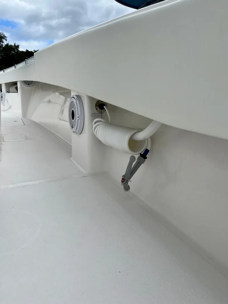 Slide: The Image of 2023 Invincible 36' Open Fisherman boat deck with hose and fittings. - 26