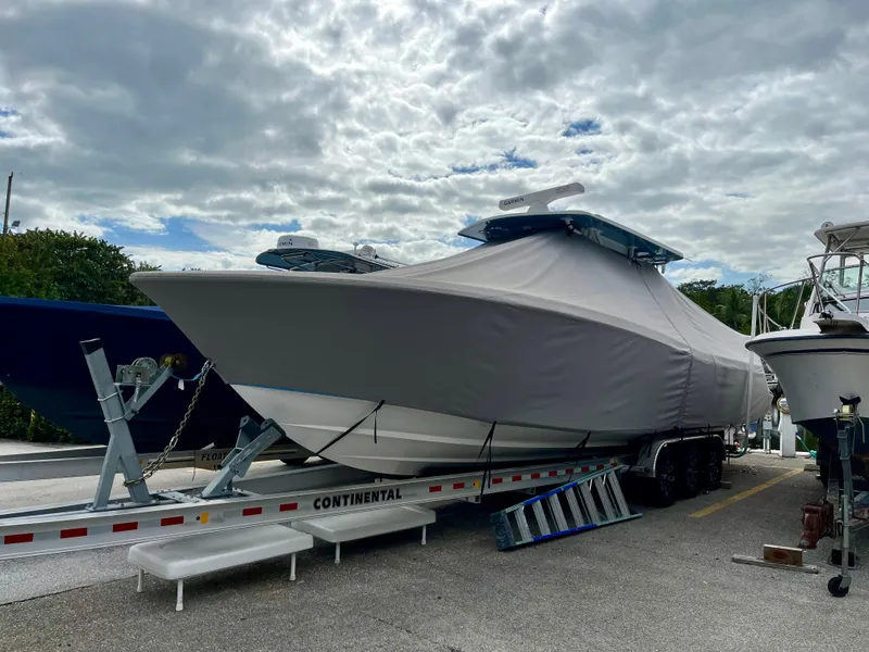 Slide: The Image of 2023 Invincible 36' Open Fisherman boat on trailer, covered and ready for transport. - 32