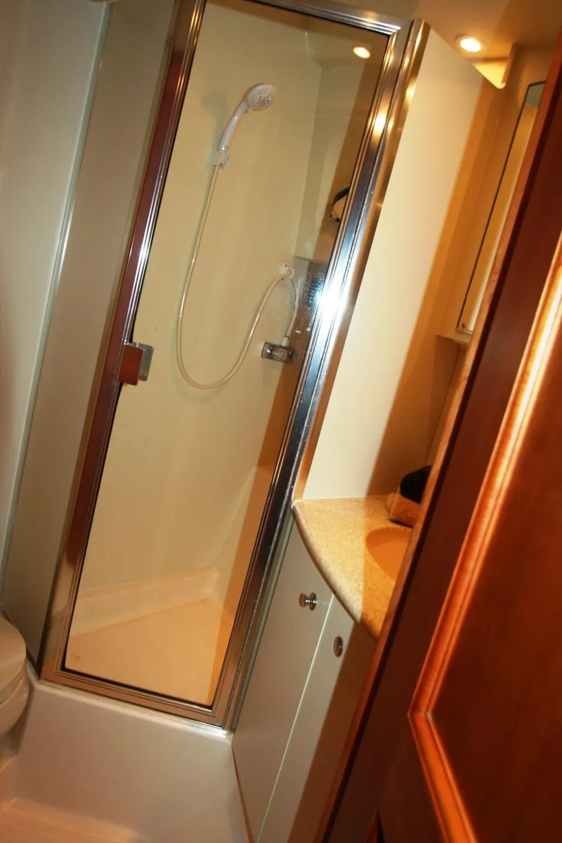 Slide: The Image of Bathroom shower in a 2000 Silverton 392 Motor Yacht. - 12