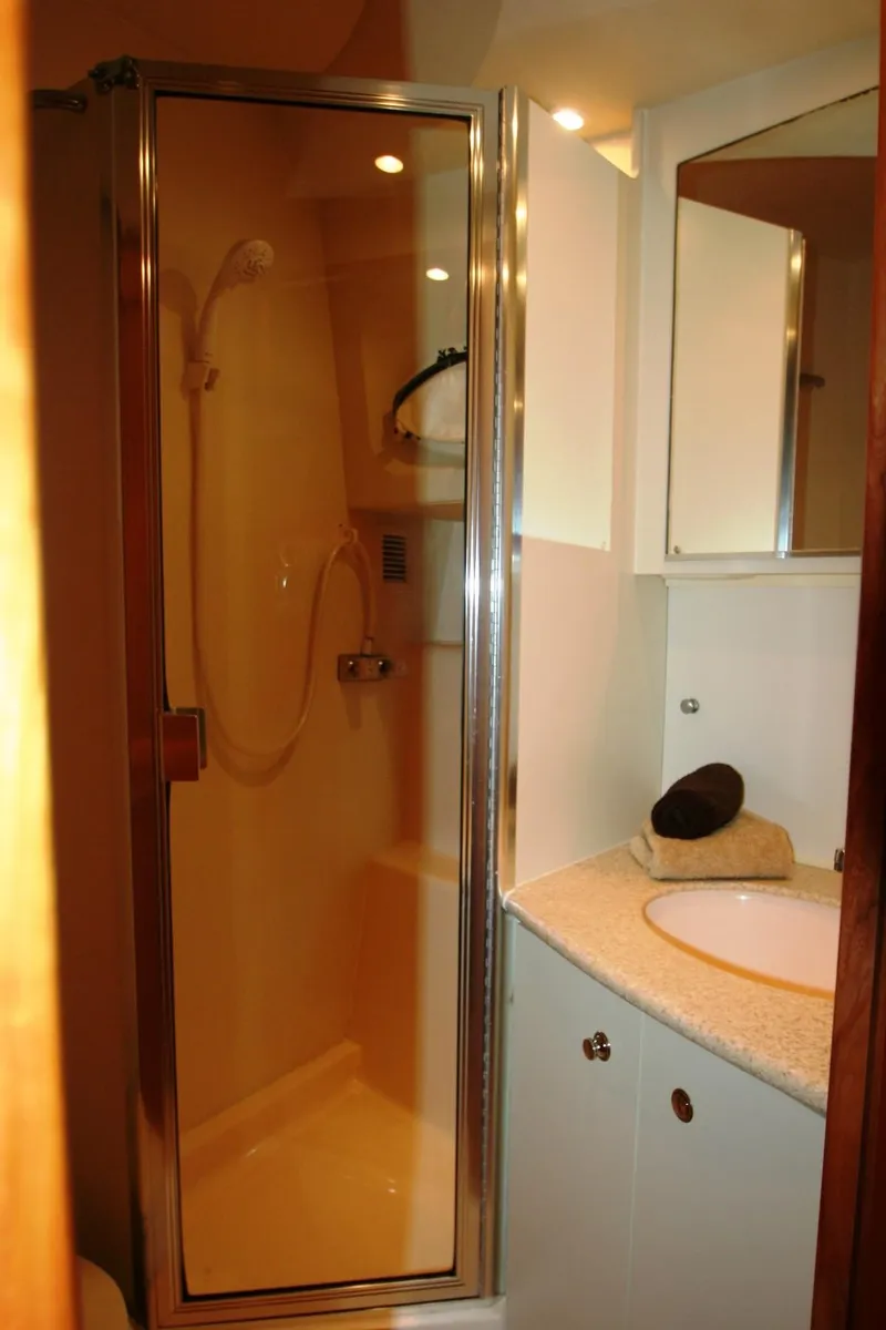 Slide: The Image of 2000 Silverton 392 Motor Yacht bathroom with shower and vanity. - 13