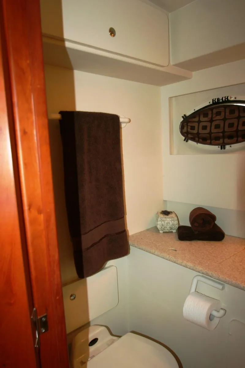 Slide: The Image of Bathroom interior of a 2000 Silverton 392 Motor Yacht with towel and decor. - 16