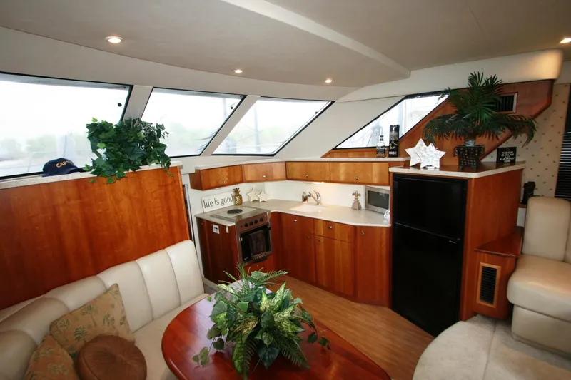 Slide: The Image of Interior of 2000 Silverton 392 Motor Yacht with kitchen and seating area. - 20