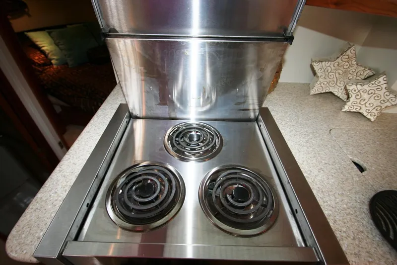 Slide: The Image of Stainless steel stove in 2000 Silverton 392 Motor Yacht kitchen. - 26