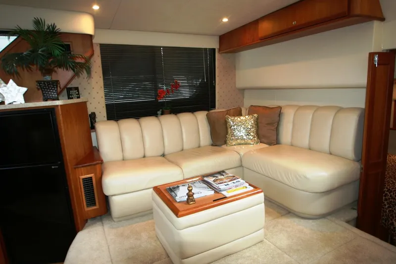 Slide: The Image of Luxurious interior of a 2000 Silverton 392 Motor Yacht with beige leather seating. - 34