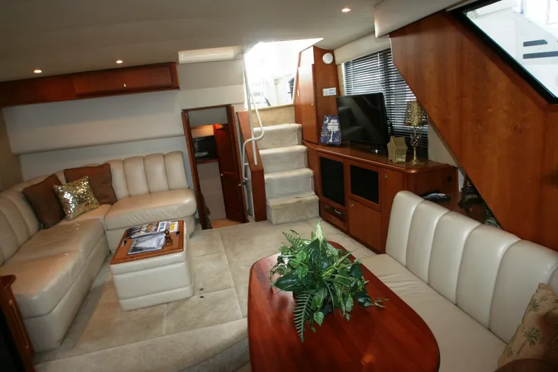 Slide: The Image of Interior of a 2000 Silverton 392 Motor Yacht with luxurious seating and entertainment area. - 35