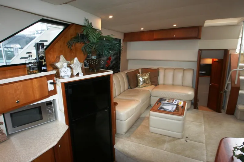 Slide: The Image of Interior of a 2000 Silverton 392 Motor Yacht with a cozy living area. - 36