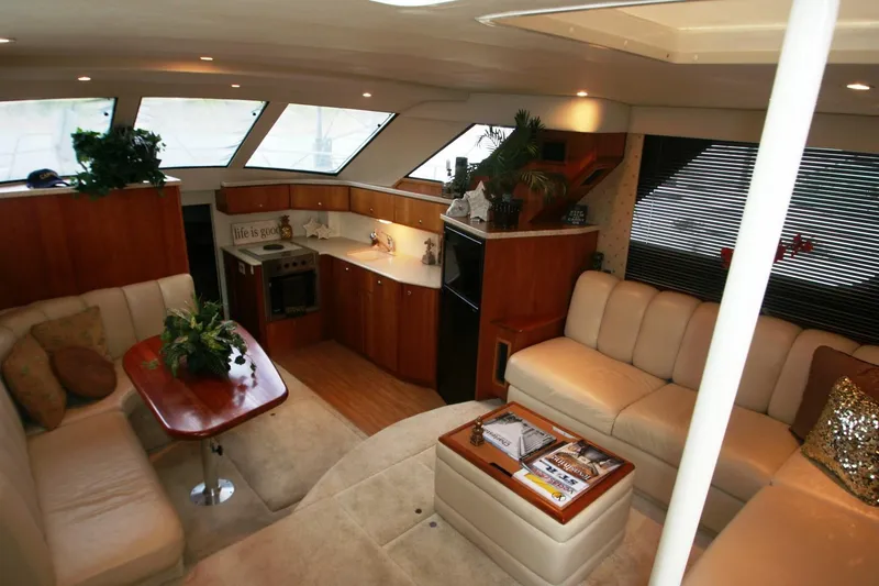 Slide: The Image of Interior of 2000 Silverton 392 Motor Yacht with spacious seating and modern kitchen. - 43
