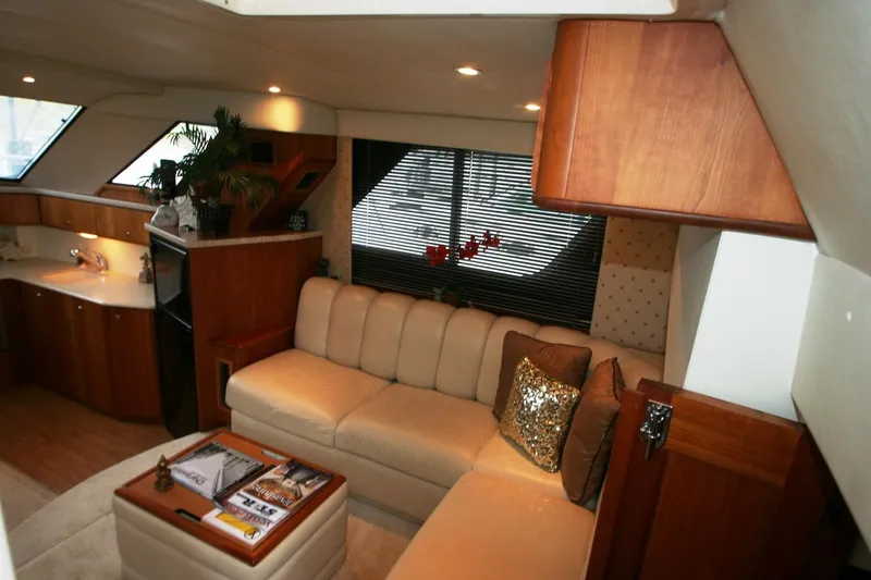 Slide: The Image of Interior of 2000 Silverton 392 Motor Yacht with beige leather sofa and wooden cabinetry. - 44