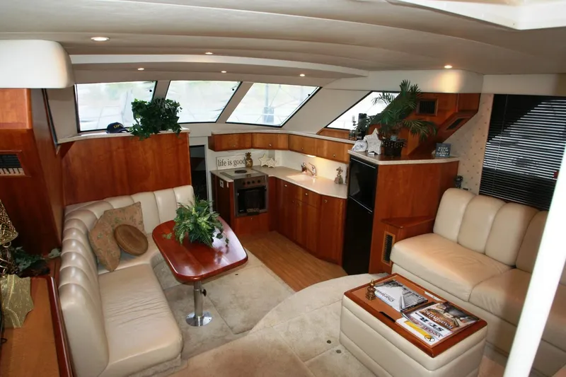Slide: The Image of Interior of 2000 Silverton 392 Motor Yacht with luxurious seating and modern kitchen. - 45