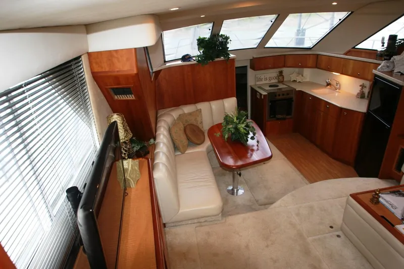 Slide: The Image of Interior of 2000 Silverton 392 Motor Yacht with kitchen and dining area. - 47