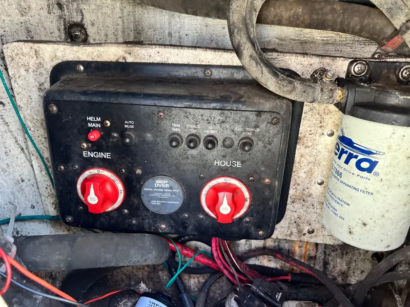 Slide: The Image of Control panel of a 2014 Striper 220 Center Console boat with wiring and filter. - 13