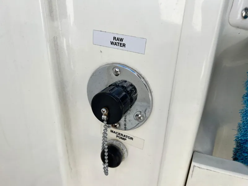 Slide: The Image of Raw water and macerator pump controls on 2014 Striper 220 Center Console boat. - 19