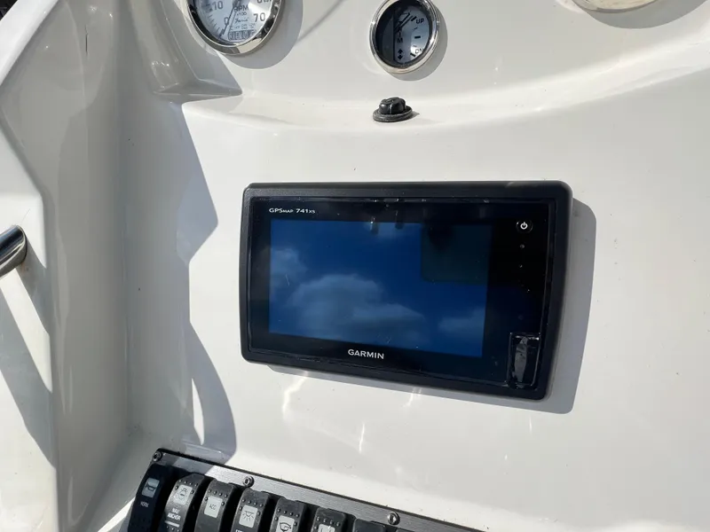 Slide: The Image of Garmin GPSMAP 741xs on 2014 Striper 220 Center Console dashboard with gauges. - 30